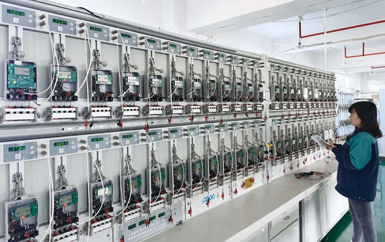Electrical devices undergoing batch functional testing at the HJATIS factory